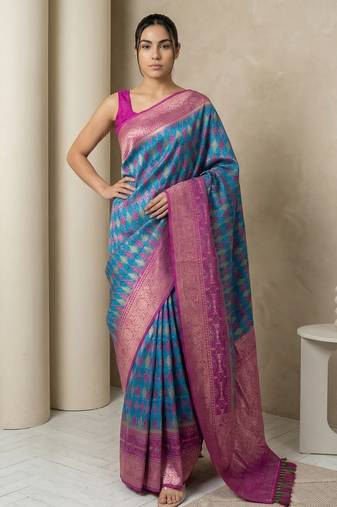 Teal geometric diamond weave pattern rich zari woven border & pallu silk blend fabric elegant festive & traditional wear