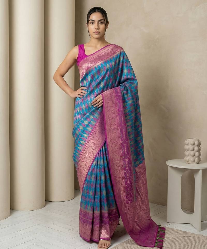 Teal geometric diamond weave pattern rich zari woven border & pallu silk blend fabric elegant festive & traditional wear