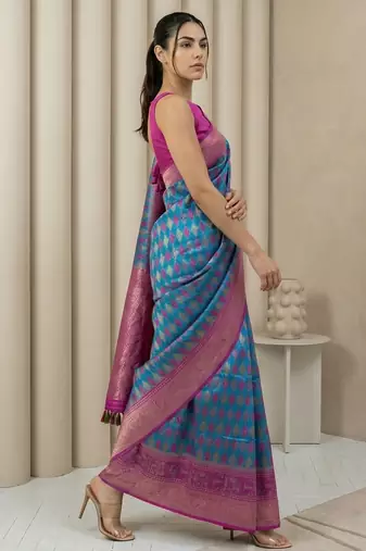 Teal geometric diamond weave pattern rich zari woven border & pallu silk blend fabric elegant festive & traditional wear