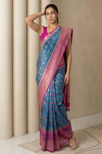 Teal geometric diamond weave pattern rich zari woven border & pallu silk blend fabric elegant festive & traditional wear