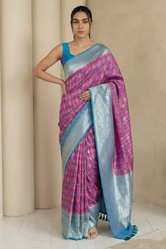 Pink geometric diamond weave pattern rich zari woven border & pallu silk blend fabric elegant festive & traditional wear