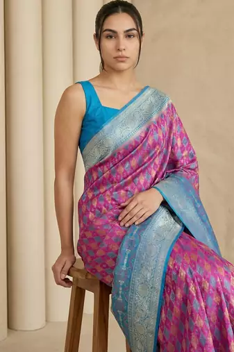 Pink geometric diamond weave pattern rich zari woven border & pallu silk blend fabric elegant festive & traditional wear