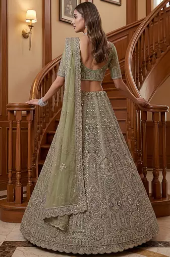 Ravishing Green Heavy Embroidered Net Evening Wear Lehenga Choli
