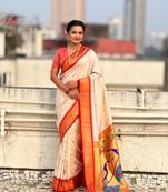 Off-white silk blend saree with orange zari border & peacock printed pallu | festive traditional wear saree