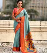 Sky blue silk blend saree with orange zari border & peacock printed pallu | festive traditional wear saree
