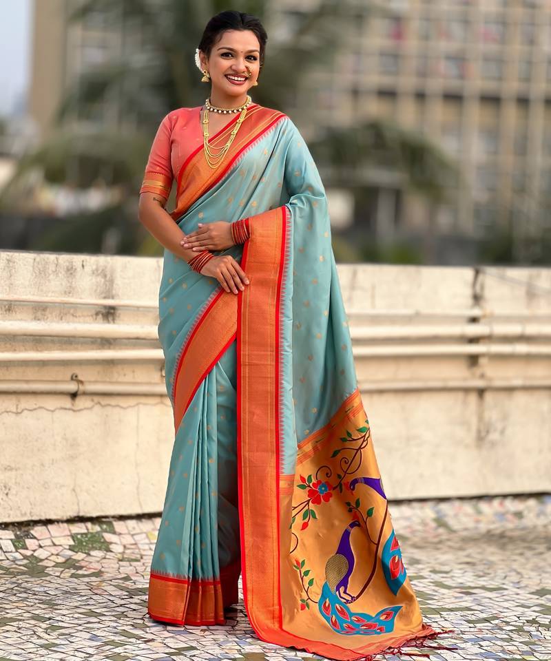 Sky blue silk blend saree with orange zari border & peacock printed pallu | festive traditional wear saree