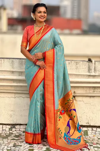 Sky blue silk blend saree with orange zari border & peacock printed pallu | festive traditional wear saree