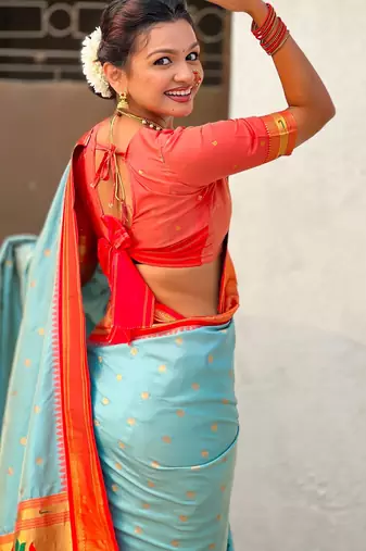 Sky blue silk blend saree with orange zari border & peacock printed pallu | festive traditional wear saree