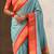 Sky blue silk blend saree with orange zari border & peacock printed pallu | festive traditional wear saree