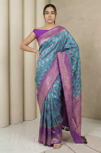 Light sea green geometric diamond weave pattern rich zari woven border & pallu silk blend fabric