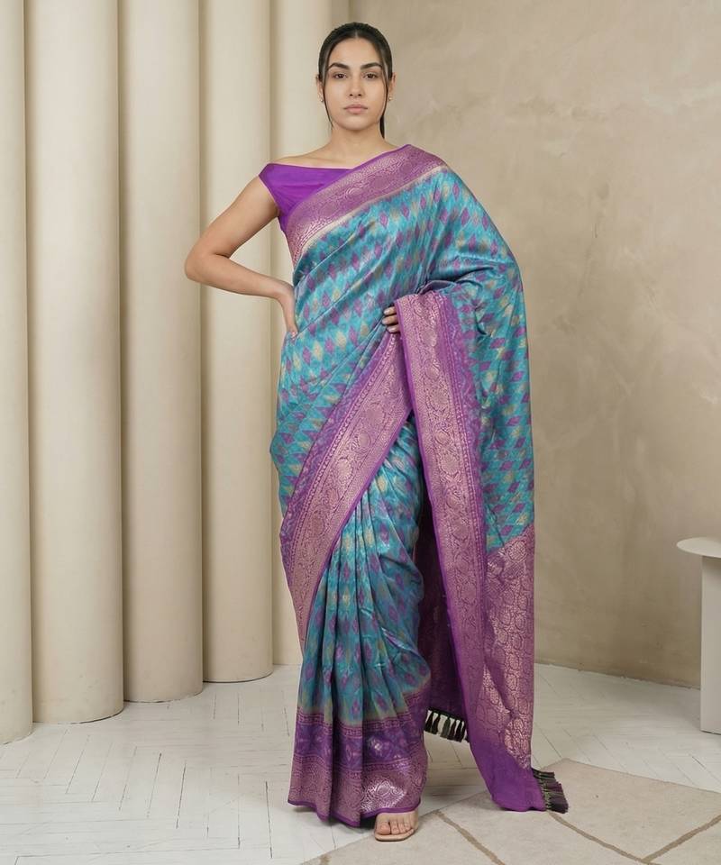 Light sea green geometric diamond weave pattern rich zari woven border & pallu silk blend fabric