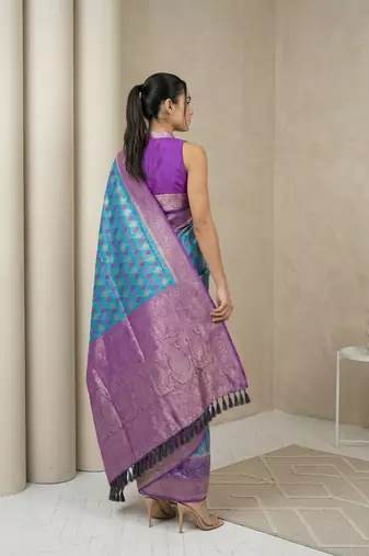 Light sea green geometric diamond weave pattern rich zari woven border & pallu silk blend fabric