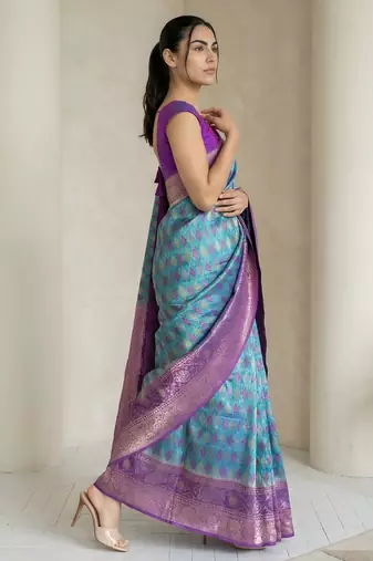 Light sea green geometric diamond weave pattern rich zari woven border & pallu silk blend fabric
