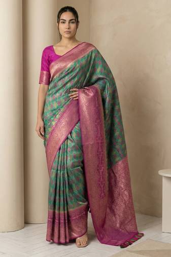Sea green geometric diamond weave pattern rich zari woven border & pallu silk blend fabric