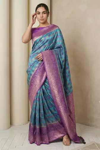 Light sea green geometric diamond weave pattern rich zari woven border & pallu silk blend fabric