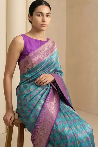 Light sea green geometric diamond weave pattern rich zari woven border & pallu silk blend fabric