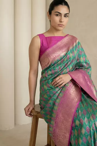 Sea green geometric diamond weave pattern rich zari woven border & pallu silk blend fabric