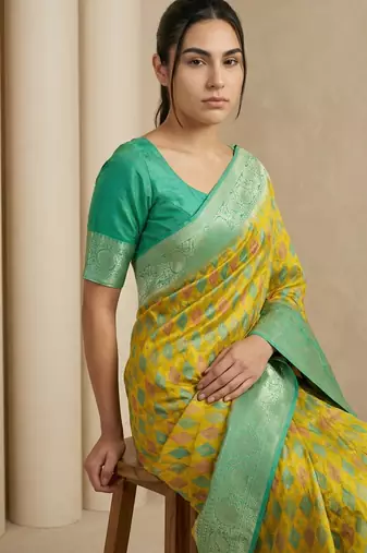 Yellow geometric diamond weave pattern rich zari woven border & pallu silk blend fabric