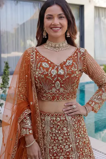 Gorgeous Orange Sequins Net Evening Wear Lehenga Choli With Dupatta