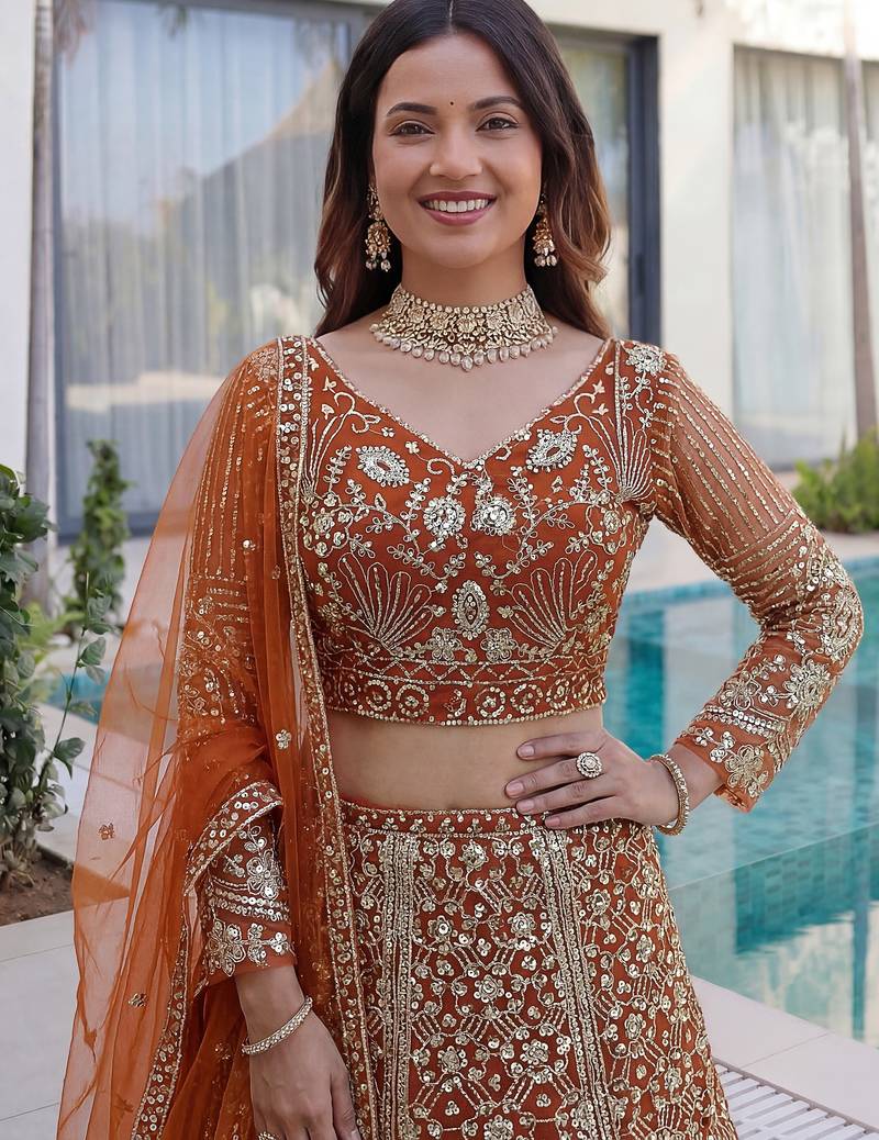 Gorgeous Orange Sequins Net Evening Wear Lehenga Choli With Dupatta