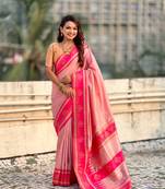 Peach border traditional butti & geometric zari work rich woven pallu design
