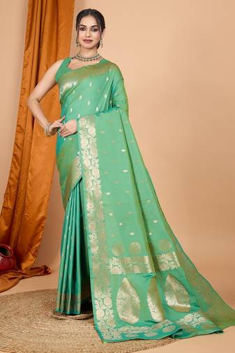 Green woven self design embellished pure silk banarasi saree with blouse