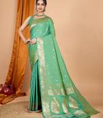 Green woven self design embellished pure silk banarasi saree with blouse