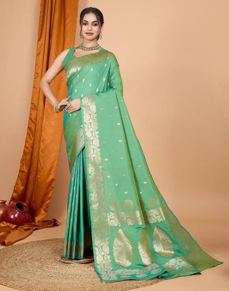 Green woven self design embellished pure silk banarasi saree with blouse