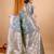 Grey woven self design embellished pure silk banarasi saree with blouse