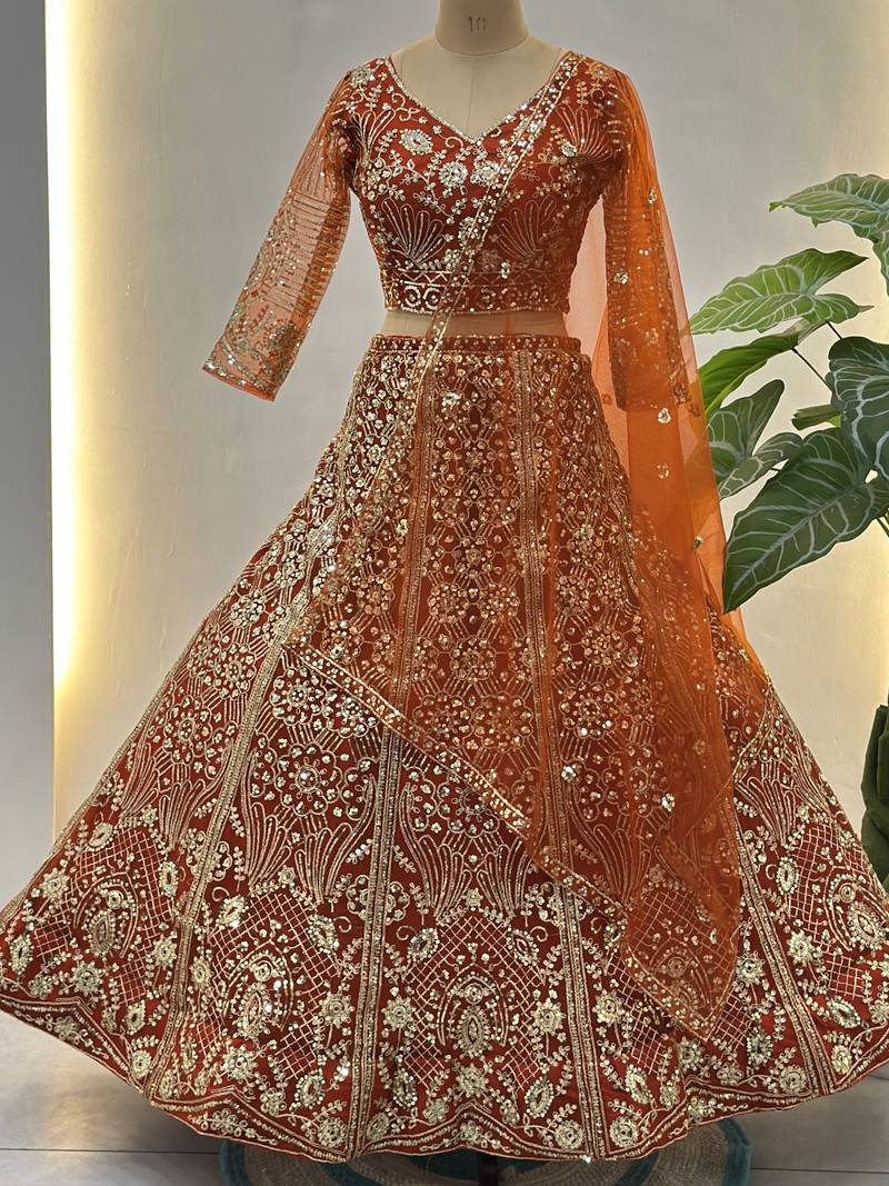 Gorgeous Orange Sequins Net Evening Wear Lehenga Choli With Dupatta