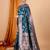 Teal blue woven self design embellished pure silk banarasi saree with blouse