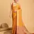 Mustard woven self design embellished pure silk banarasi saree with blouse