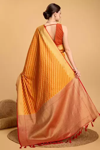 Mustard woven self design embellished pure silk banarasi saree with blouse