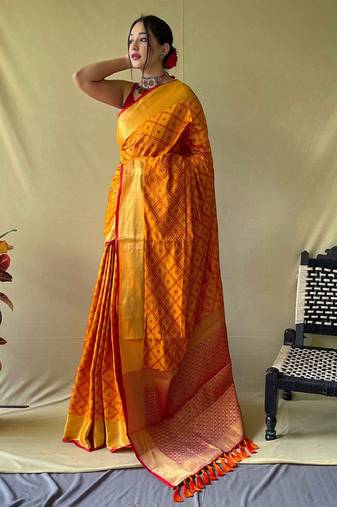 Mustard woven self design embellished pure silk patola saree with blouse