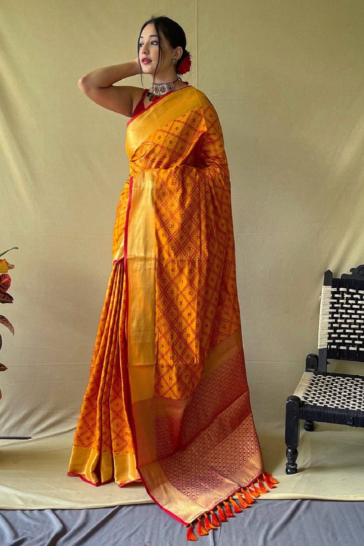 Mustard woven self design embellished pure silk patola saree with blouse