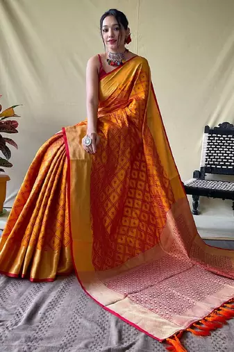 Mustard woven self design embellished pure silk patola saree with blouse