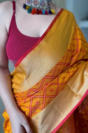 Mustard woven self design embellished pure silk patola saree with blouse