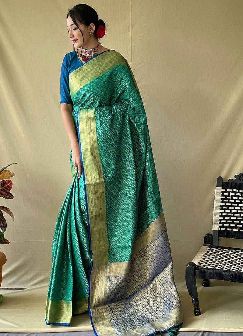 Rama woven self design embellished pure silk patola saree with blouse