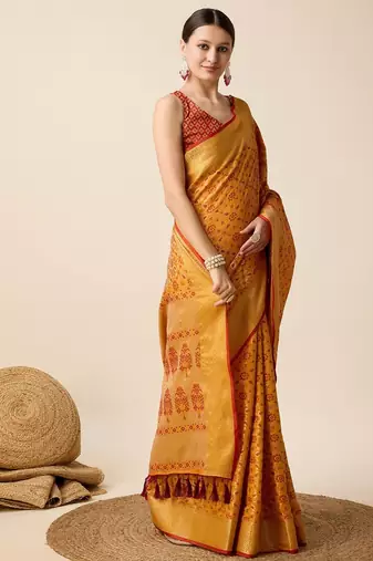 Mustard woven self design embellished pure silk banarasi saree with blouse