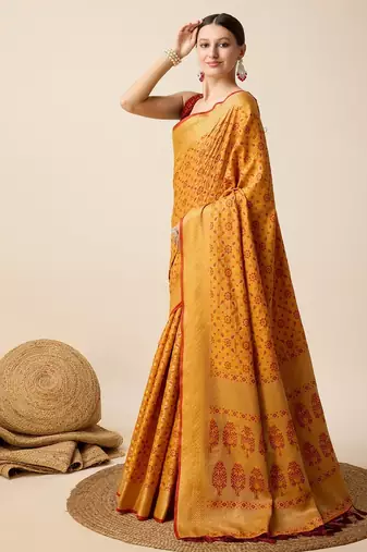 Mustard woven self design embellished pure silk banarasi saree with blouse