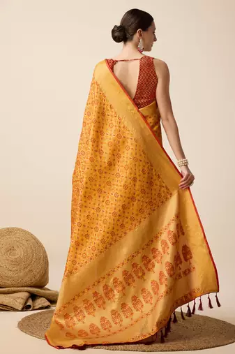 Mustard woven self design embellished pure silk banarasi saree with blouse