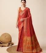Red woven self design embellished pure silk banarasi saree with blouse
