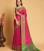 Dark pink woven self design embellished pure silk patola saree with blouse