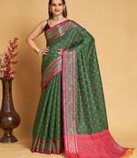 Green woven self design embellished pure silk patola saree with blouse