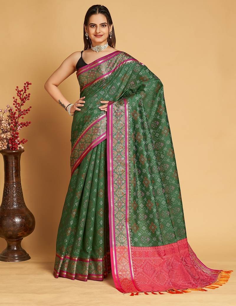 Green woven self design embellished pure silk patola saree with blouse