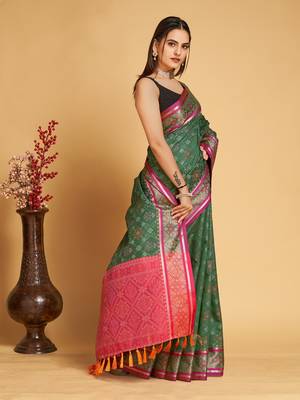 Green woven self design embellished pure silk patola saree with blouse 4