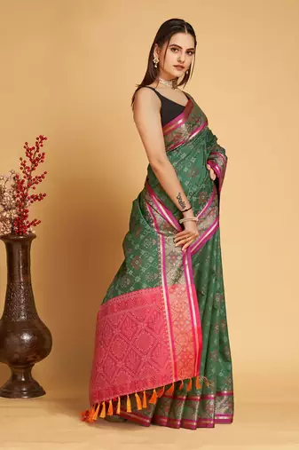 Green woven self design embellished pure silk patola saree with blouse