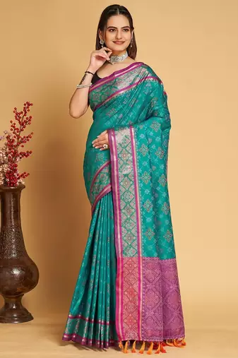 Teal blue woven self design embellished pure silk patola saree with blouse