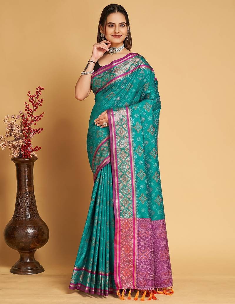 Teal blue woven self design embellished pure silk patola saree with blouse