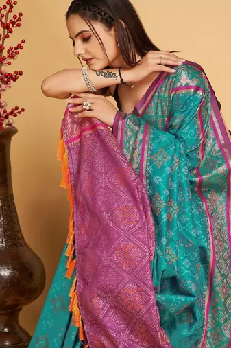 Teal blue woven self design embellished pure silk patola saree with blouse